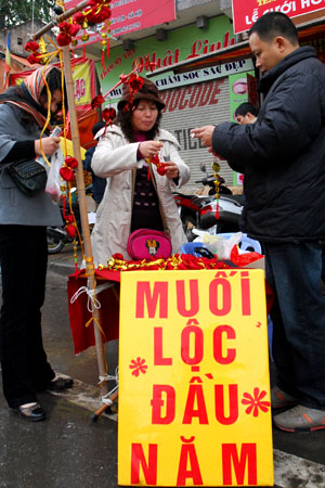 nhung dieu nen va khong nen trong ngay mung 1 tet cho ca nam may man