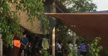 Sau tiếng súng, một phụ nữ bị trọng thương trong nhà